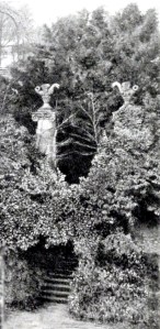 Steps leading down from the old gate pillars topped with wyverns